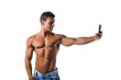 © theartofphoto - Handsome muscular young man taking selfie with cell phone
