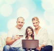 © Syda Productions - happy family with laptop computer and credit card