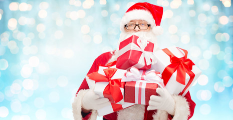 Sticker - man in costume of santa claus with gift boxes