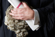 Close Up Of Barrister Holding Wig And Brief