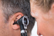 Doctor Examining Patient's Ear