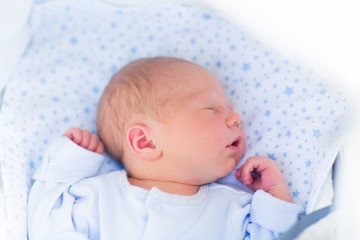 Wall Mural - sleeping baby in a white stroller