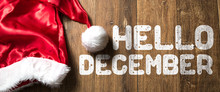 Hello December Written On Wooden Background With Santa Hat