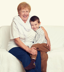 Wall Mural - child boy and grandmother on white, happy family concept