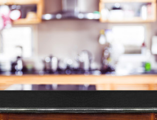 Wall Mural - empty black marble table top and blurred kitchen bokeh light in