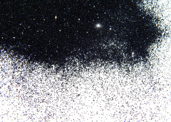 Wall Mural - Black glitter sparkle on white background with space for text