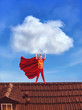 Little girl in costume holding a big cloud