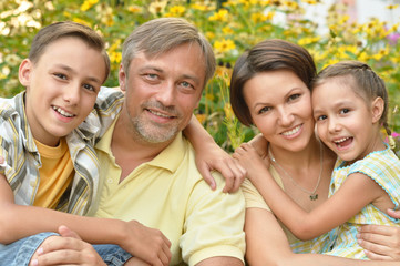 Wall Mural - happy family at  blooming field