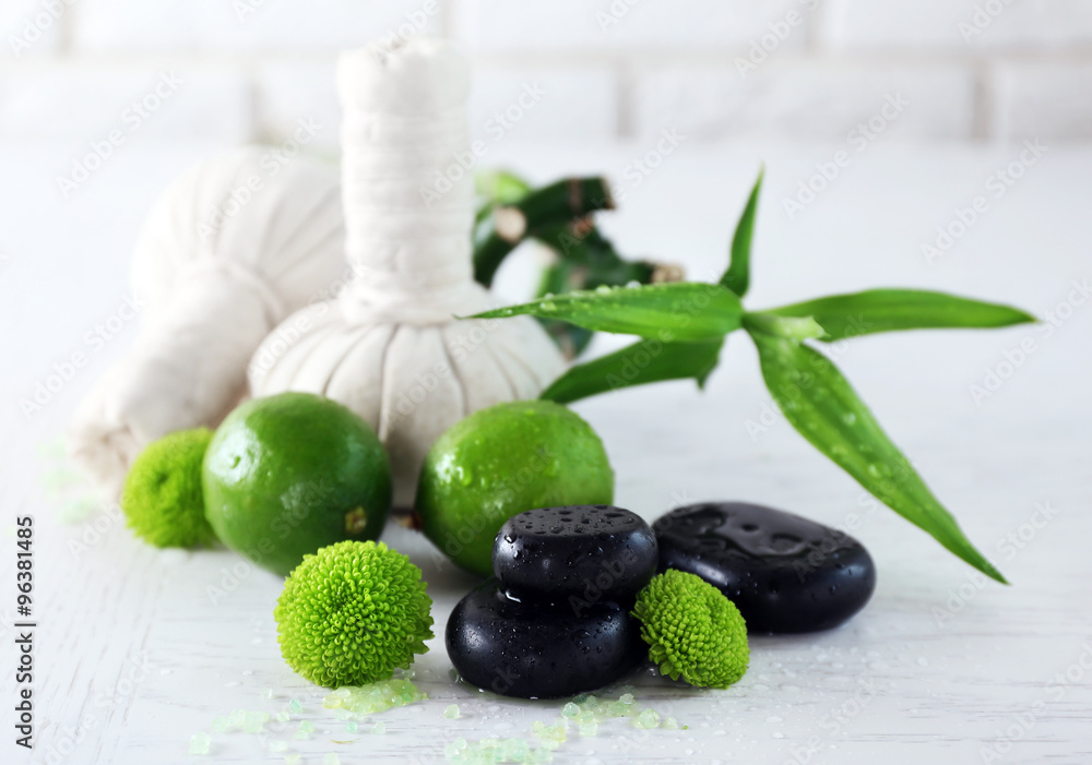 Beautiful composition of spa treatment on white wooden table
