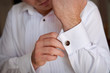 close up of a hand man how wears white shirt and cufflink