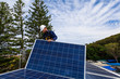 © Zstock - Solar panel technician installing solar panels