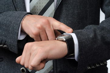 Wall Mural - businessman watching time at their wristwatches