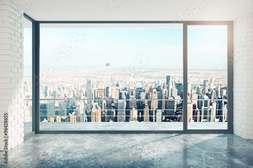 Cuadros en Lienzo Empty loft room with big window in floor and city view