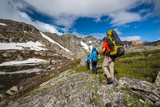 Fototapeta Las - Young people are hiking in highlands of Altai mountains, Russia