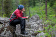 © Maygutyak - Backpacker is resting while hiking in mountains