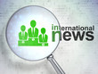 © Maksim Kabakou - News concept: Business Team and International News with optical glass