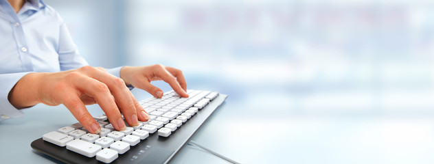 Aufkleber - Hands typing on computer keyboard.