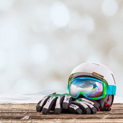 Colorful ski glasses, gloves and helmet