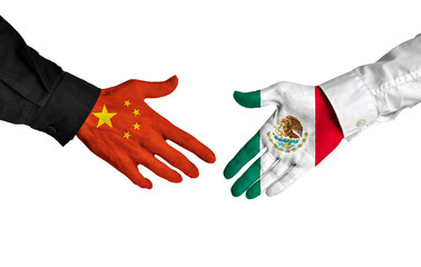 Wall Mural - China and Mexico leaders shaking hands on a deal agreement