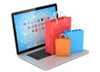 © Natalia Merzlyakova - laptop and  shopping pags on white background
