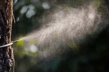 Sprinkling machine water in the garden.