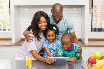 Happy family using tablet 