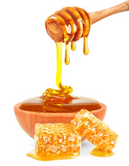 Wall Mural - honey in a bowl and honeycomb isolated 