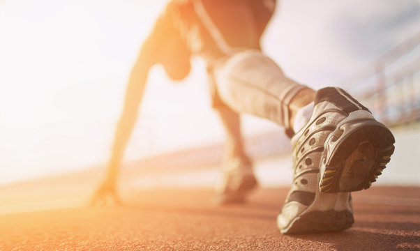 Fototapete - Athlete runner feet running on treadmill closeup on shoe