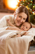 © Кирилл Рыжов - portrait of mother and baby boy at decorated room for Christmas