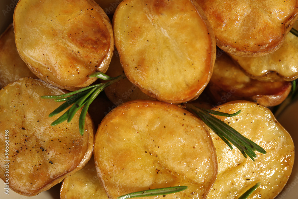 Delicious baked potato with rosemary close up