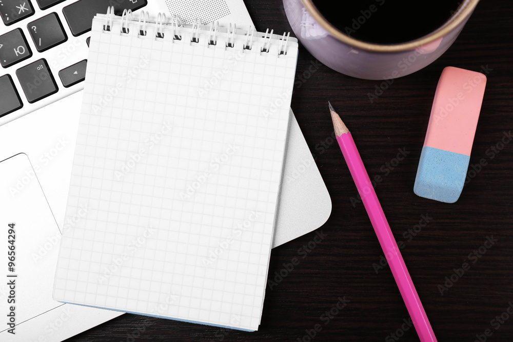 Close-up of comfortable working place on wooden background, top view