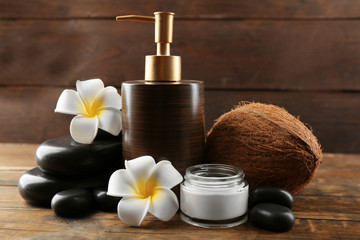 Wall Mural - Spa coconut products on dark wooden background