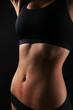 © Africa Studio - Slim female body in nice black lingerie on dark background