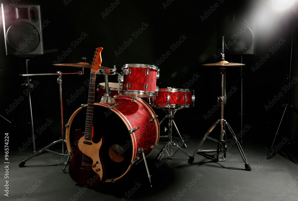 Musical instruments on a stage on dark background