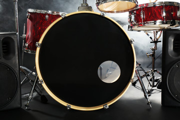 drum set in smoke on a stage