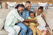 © WavebreakmediaMicro - Happy family posing on the couch together