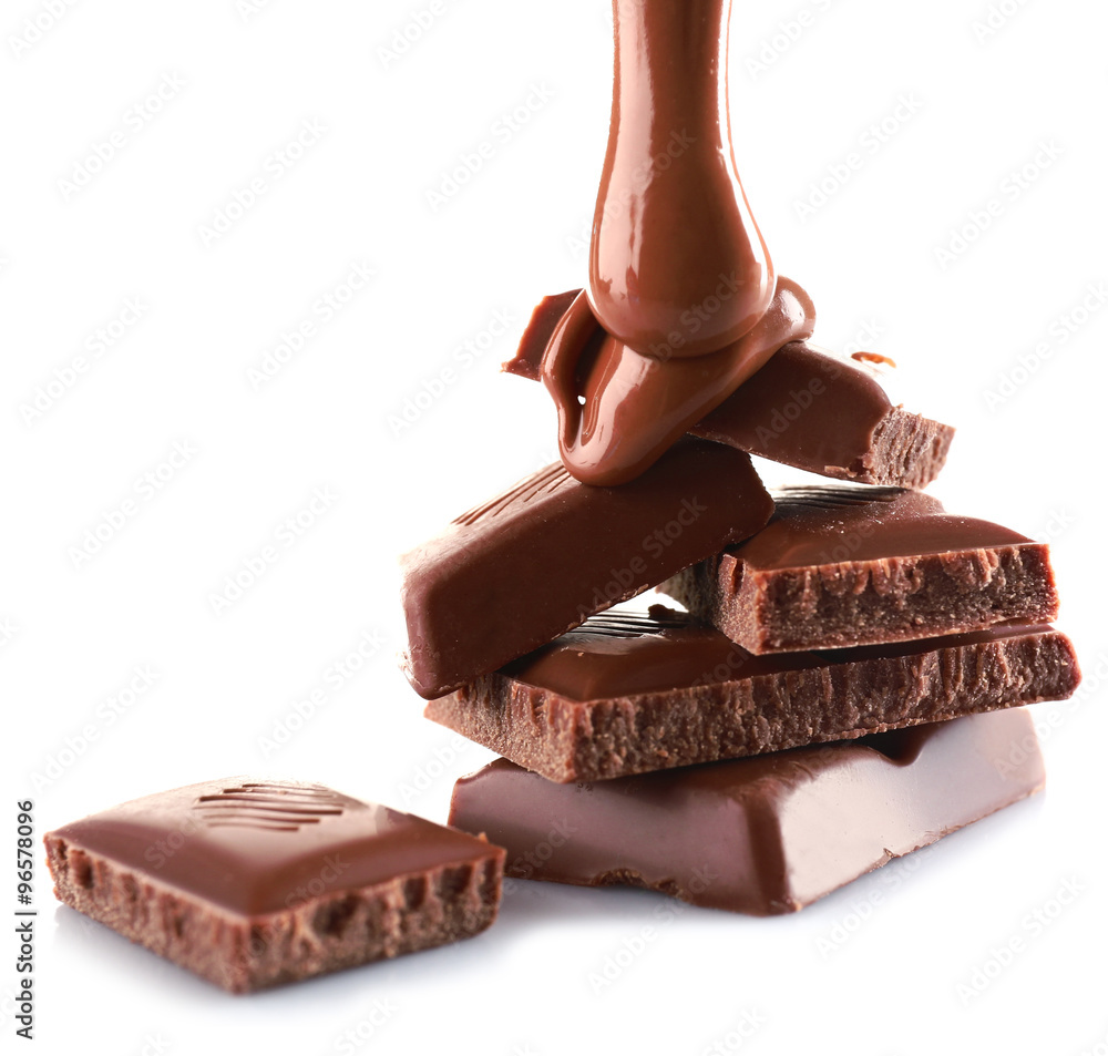 Pieces of chocolate bar and melted topping, isolated on white