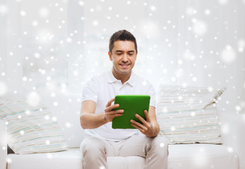 Poster - smiling man working with tablet pc at home