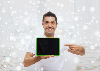 Sticker - smiling man showing tablet pc blank screen at home