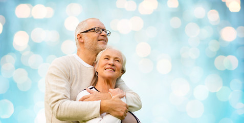 Canvas Print - happy senior couple over blue holidays lights