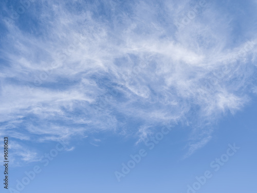 Naklejka ścienna Cirrus clouds in the blue sky.