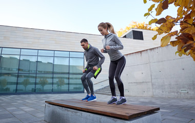 Poster - man and woman exercising on bench outdoors