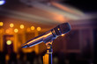 Wireless microphone stand on the stage venue with blur bokeh bac