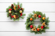 © nioloxs - Christmas wreath on white wooden table top view