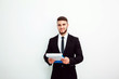 © kanashkin - Portrait of an handsome businessman with a folder