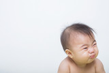 Fototapeta Desenie - Portrait of a fever baby crying on background