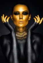 Beautiful Woman Portrait In Gold And Black Colors