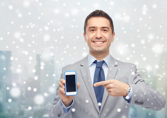 Poster - happy businessman showing smartphone screen