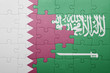 © luzitanija - puzzle with the national flag of saudi arabia and qatar