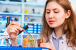 © luchschenF - girl in the laboratory of food quality tests legumes grain